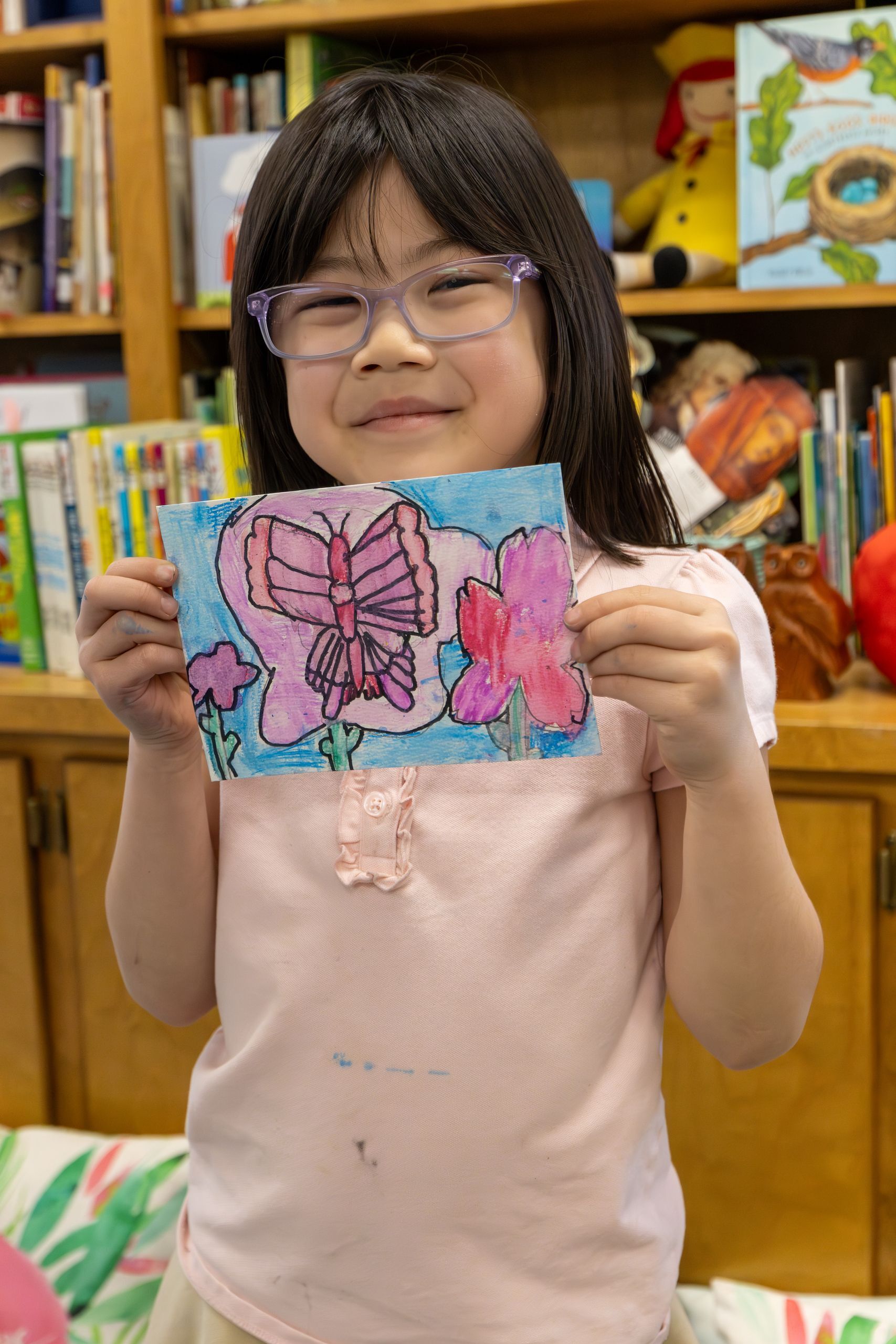 Child holding painting