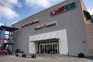 Gray building with Red Oak Ballroom Norris Centers signs