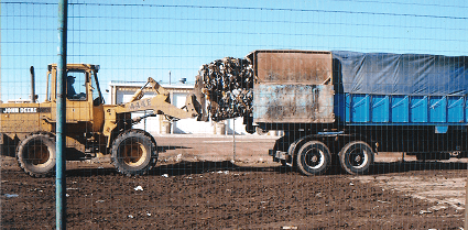 Bales Being Loaded Into Bale Truck