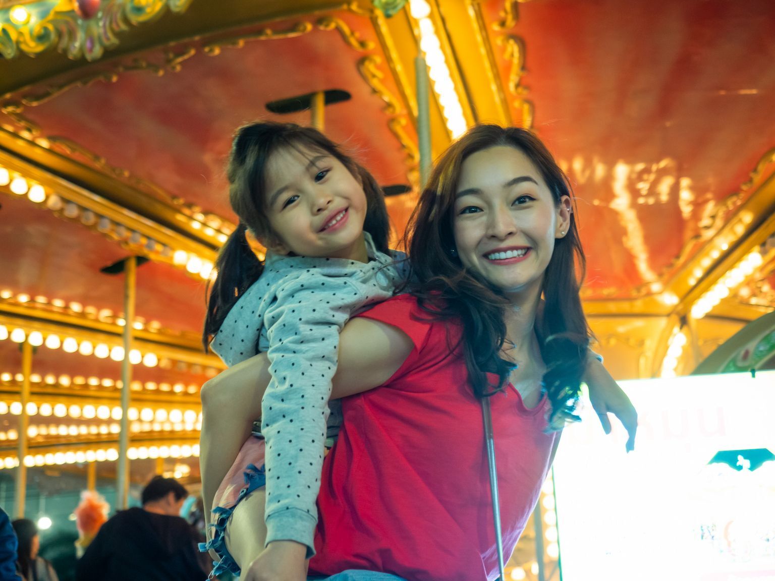 Mother and daughter enjoying time together at a local fair
