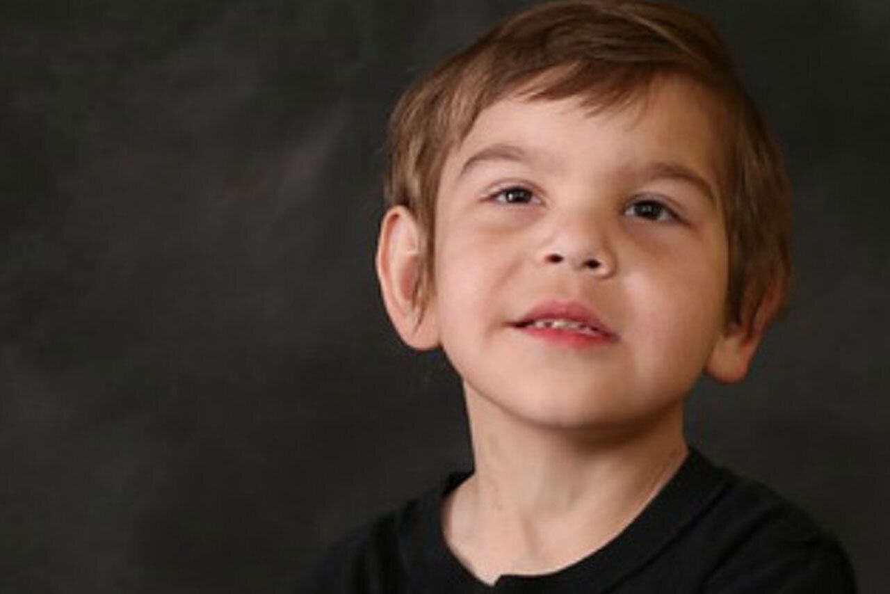 Young boy with barth syndrom smiling