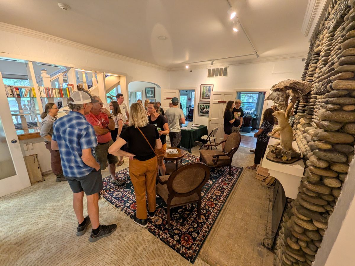 WRI volunteers mingling in the River Haus during the 2025 Volunteer Open House.