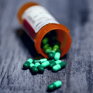 bottle of pills spilled on table