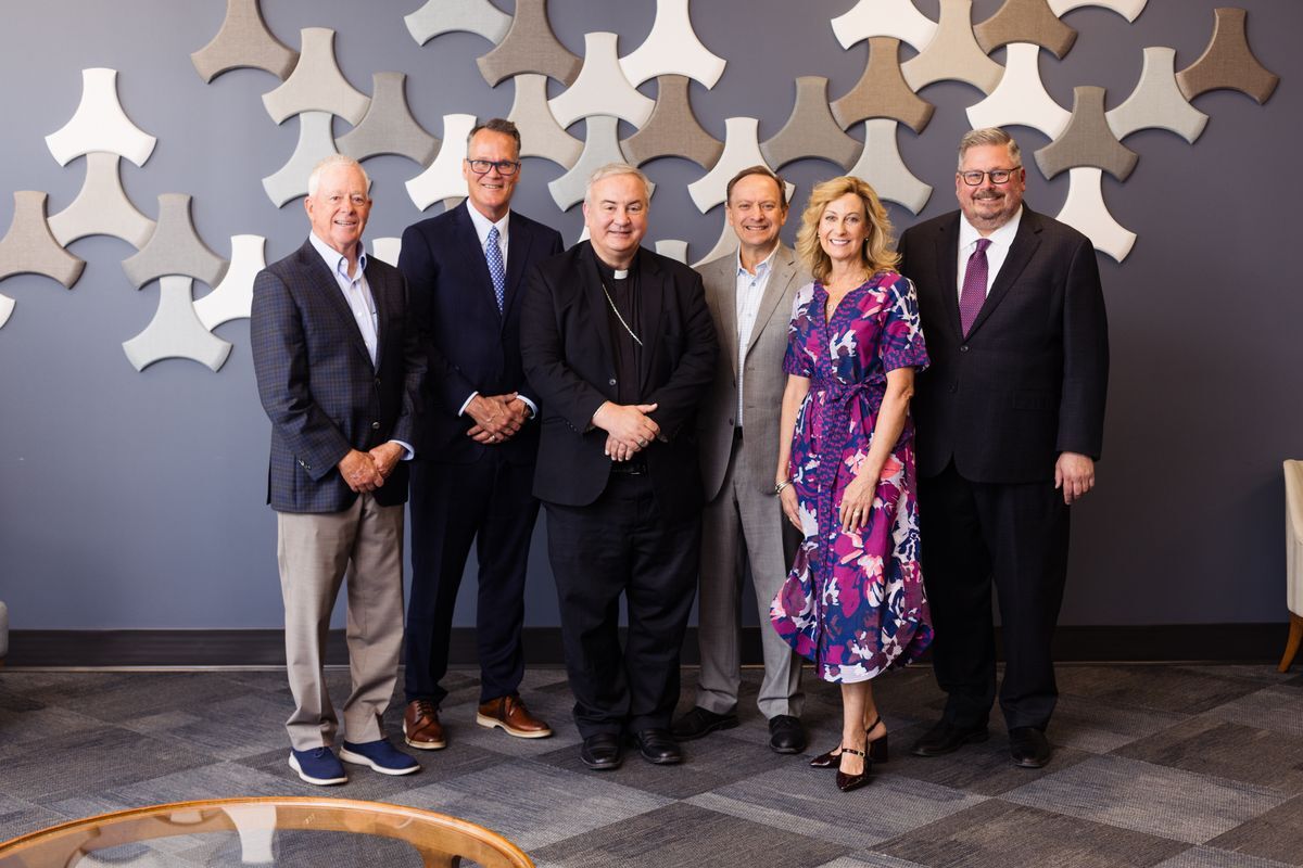 Bruce Rasmussen, Joel Long, Archbishop Michael McGovern, Rick Bettger, Jen Bettger, and Rob Reed, Jr.