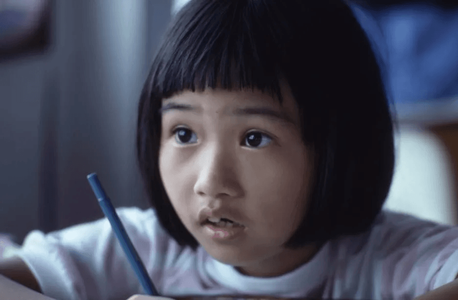 Child holding pen