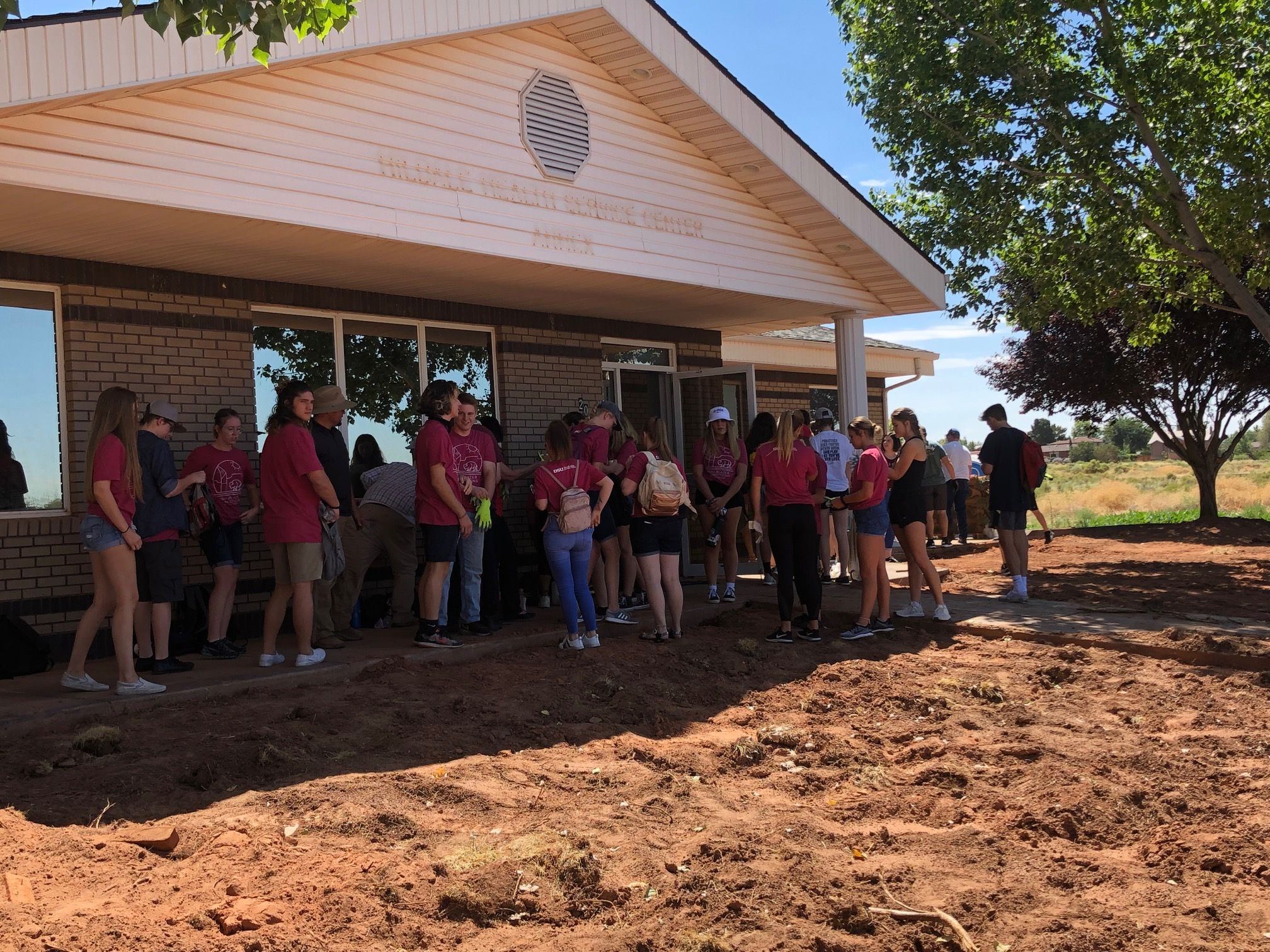 DSU students prepare to lay sod at the Creek Valley Health Center in polygamist community of Colorado City