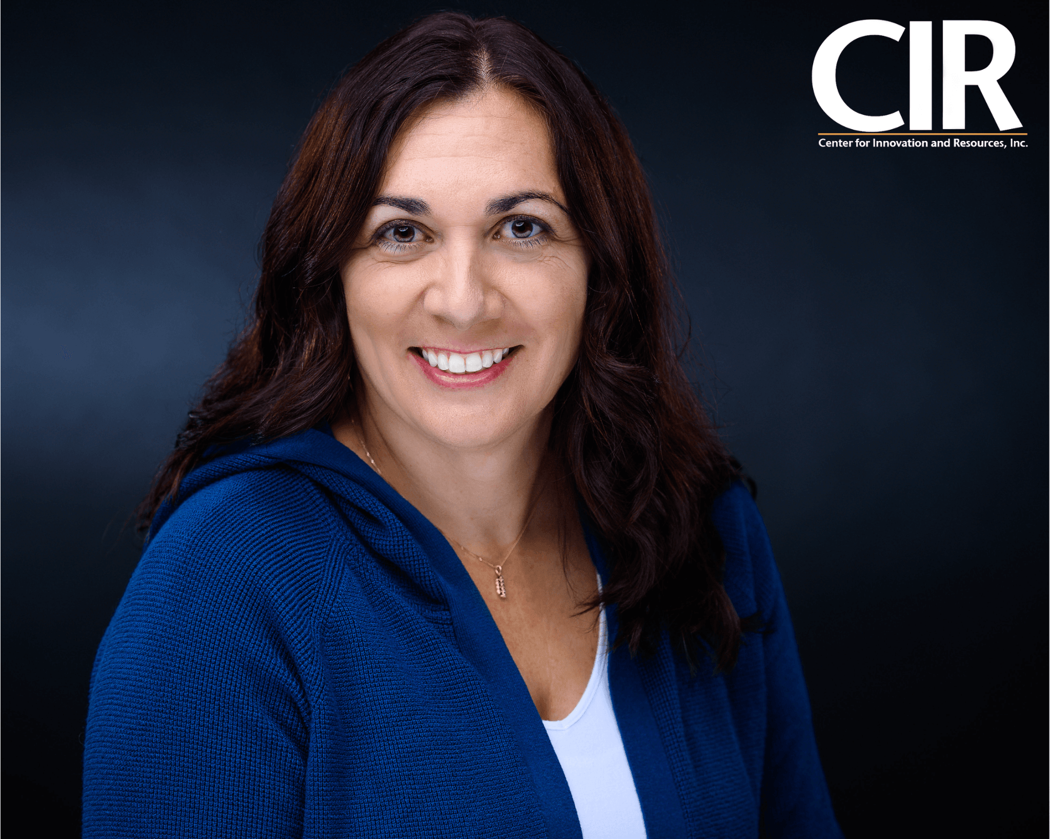 Photo of the executive director, Sonia Sandoval-Edinger in a blue blazer and white top.