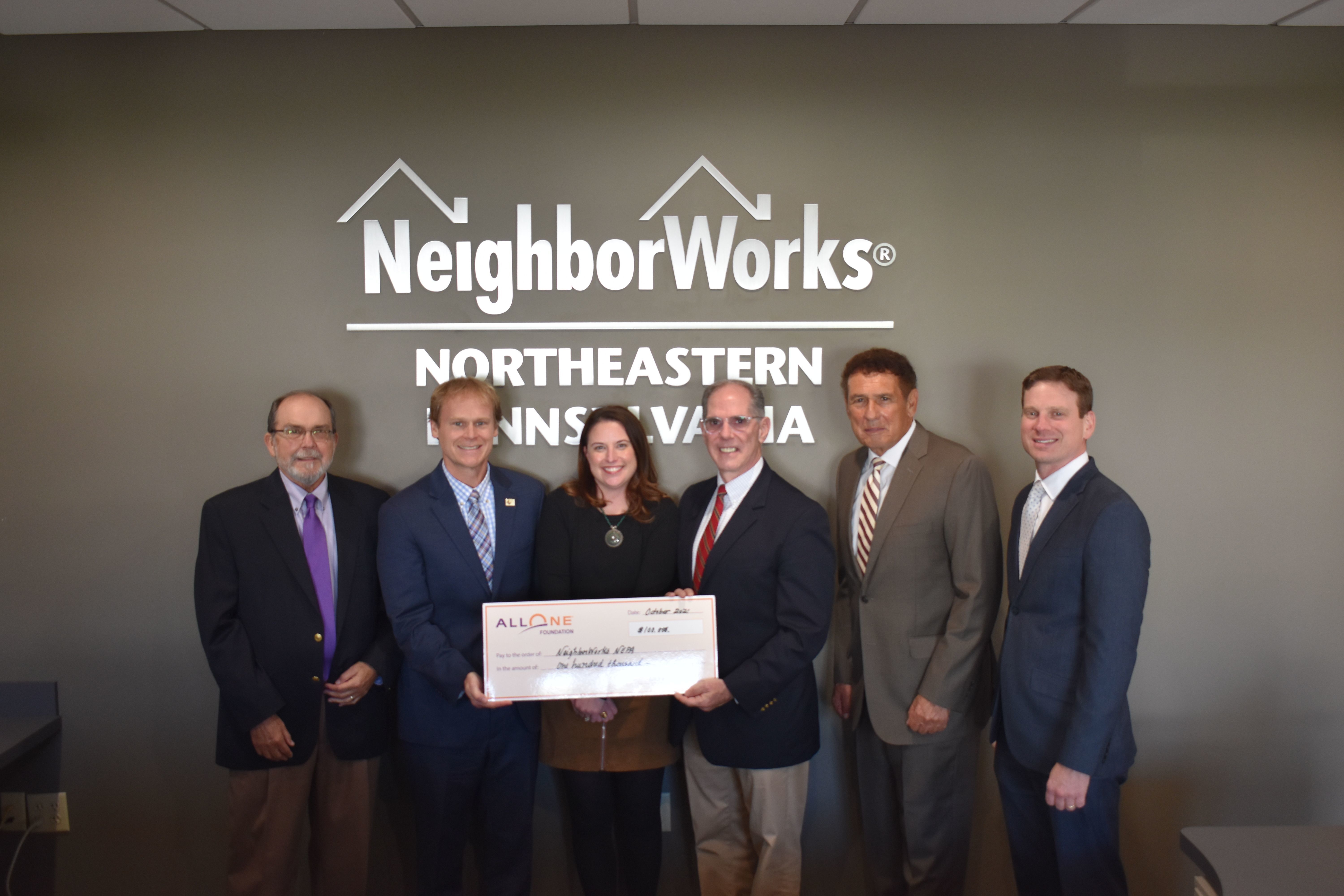 Pictured left to right: John Menapace, Board Member, AllOne Foundation & Charities; Teddy Michel, Director, Ignatian Volunteer Corps of Northeastern Pennsylvania; Mary Endrusick, Aging in Place Coordinator, NeighborWorks; John Cosgrove, Executive Director