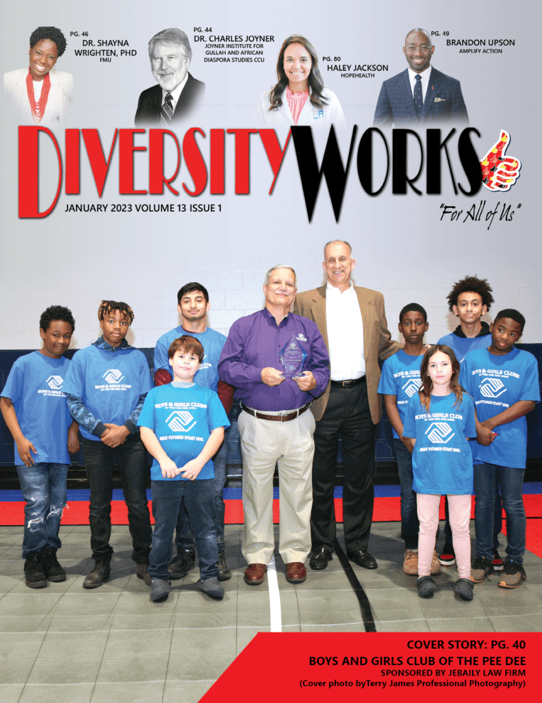 Club members stand with Executive Director Neal Zimmerman on the cover of Diversity Works magazine.