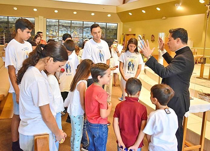 Children, families join in prayer, form human rosary