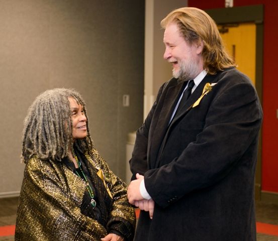 Inductees Sonia Sanchez and Rick Bragg chat in the media green room.
