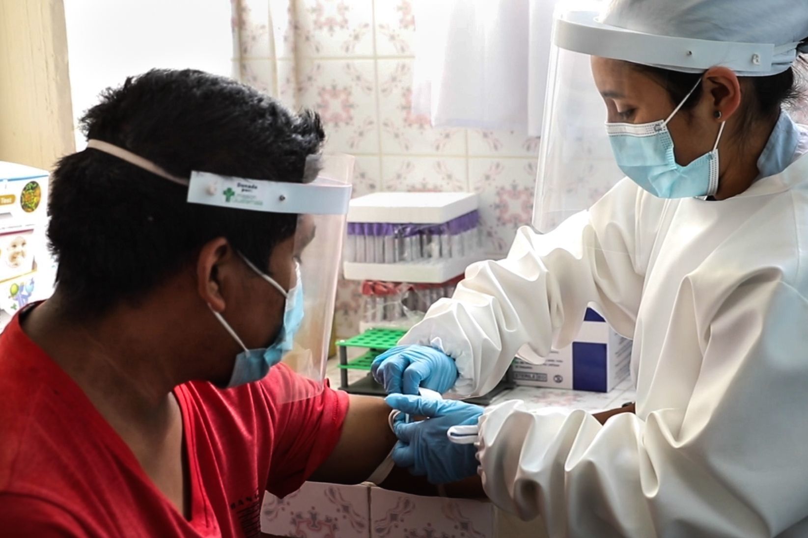 One of Mission Guatemala's nurses with a patient