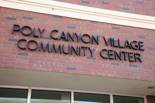 M7952 - Precision Machined Bronze  Letters for Poly Canyon Village  Mounted on a Brick Wall 