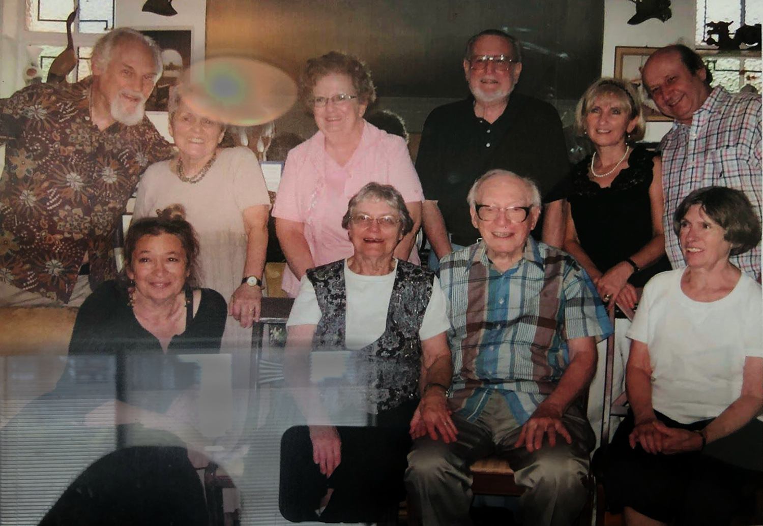 Abe Schwartz sitting with his wife and friends