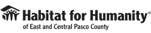 Black and white logo of Habitat for Humanity of East and Central Pasco County, featuring the iconic house and family symbol to the left of the organization’s name.