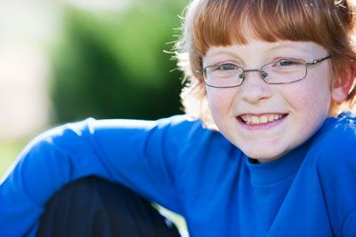 Smiling boy with glasses