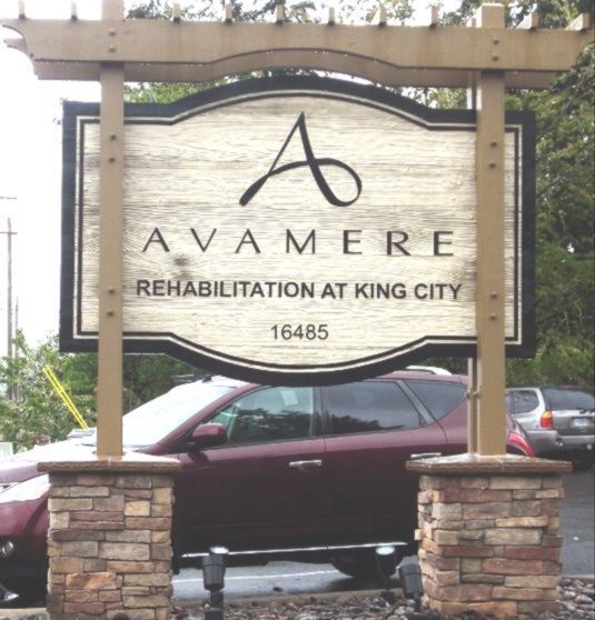 M4824 - Two  4 " x 4" Cedar Wood Posts and Top  Pergola-style Wood Beam  Support  this Sign for the Avamere Rehabilitation Center.