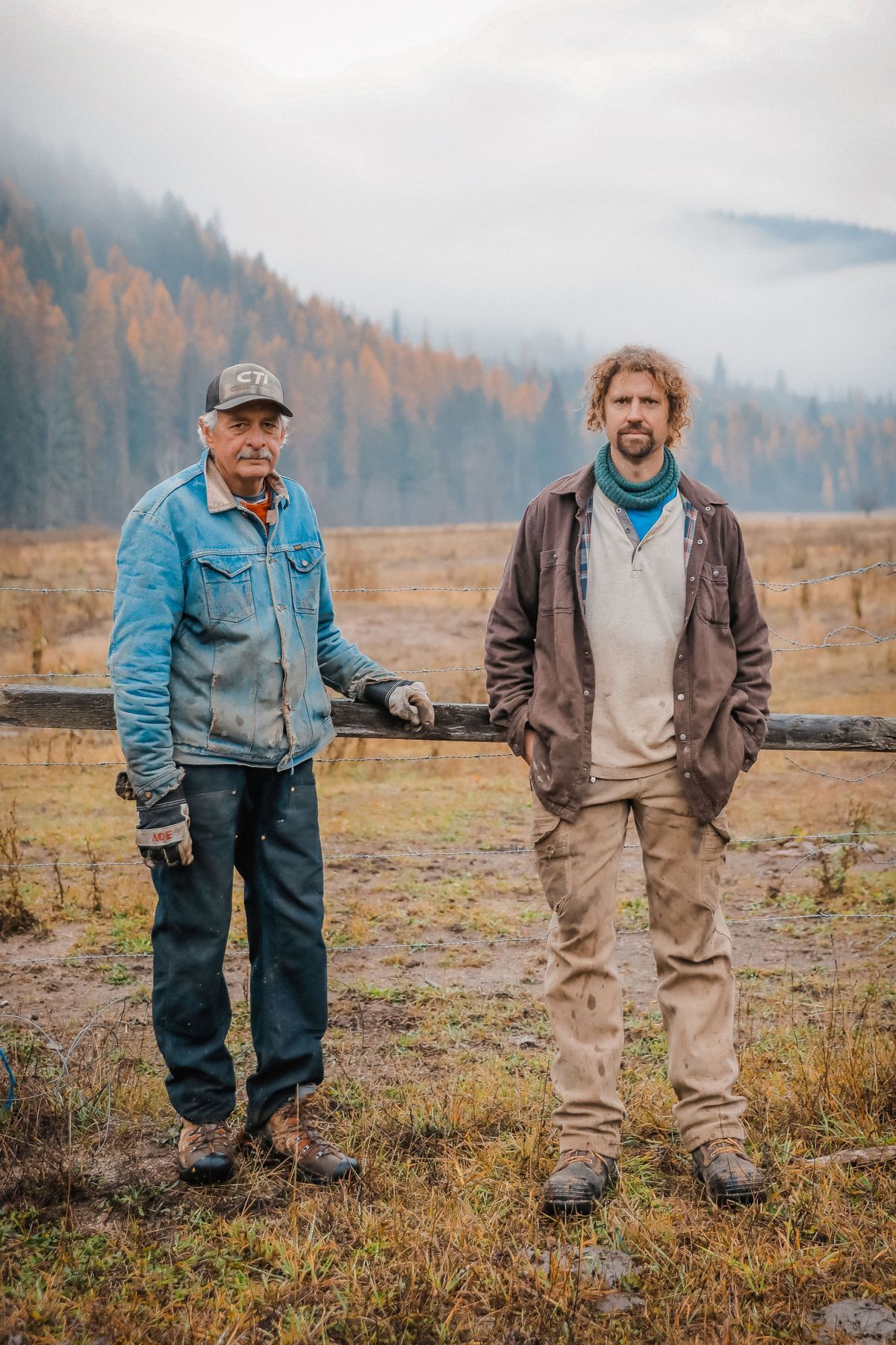 A picture of a male standing on a rock looking at Prusik Peak in the Enchantments.