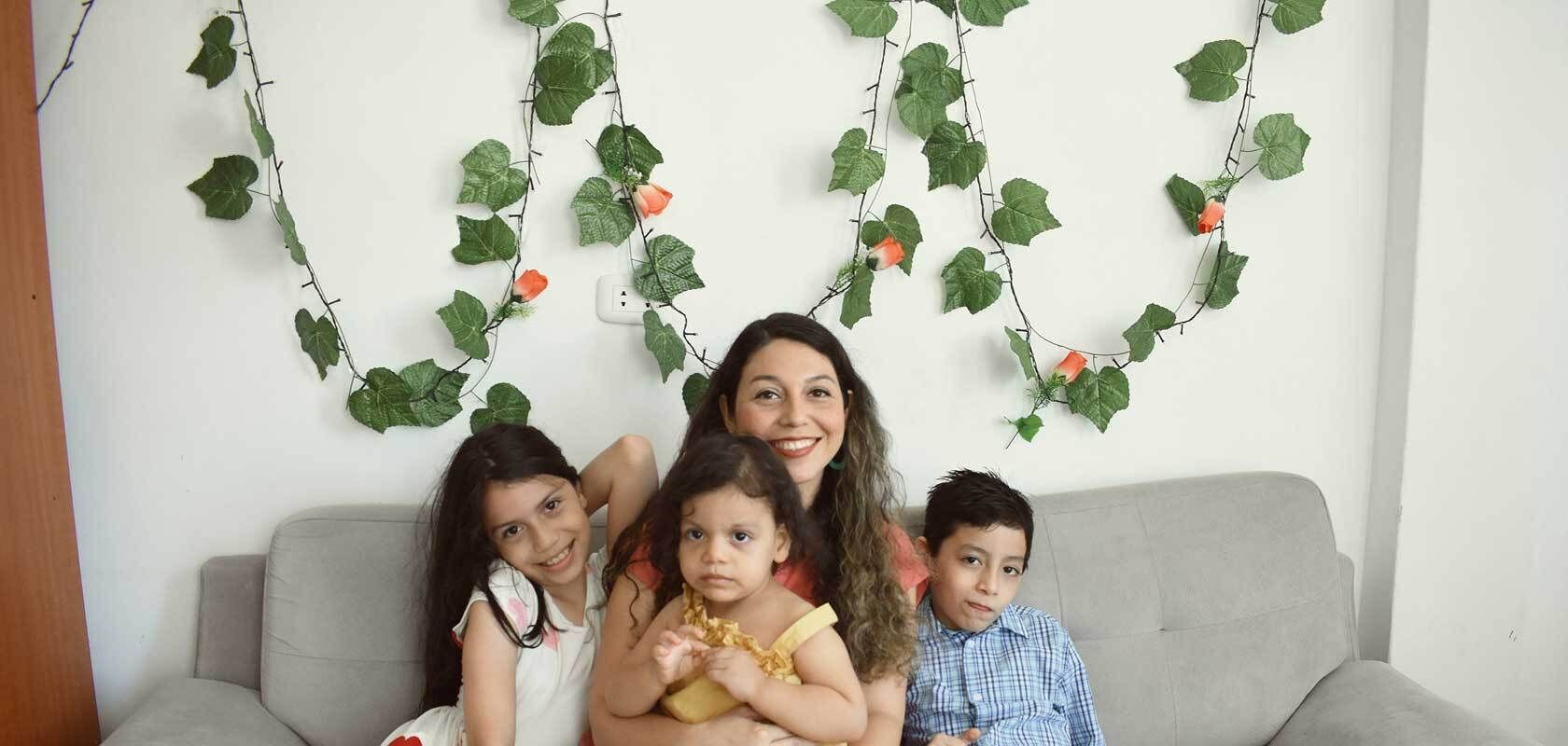 Woman and children sitting on a couch