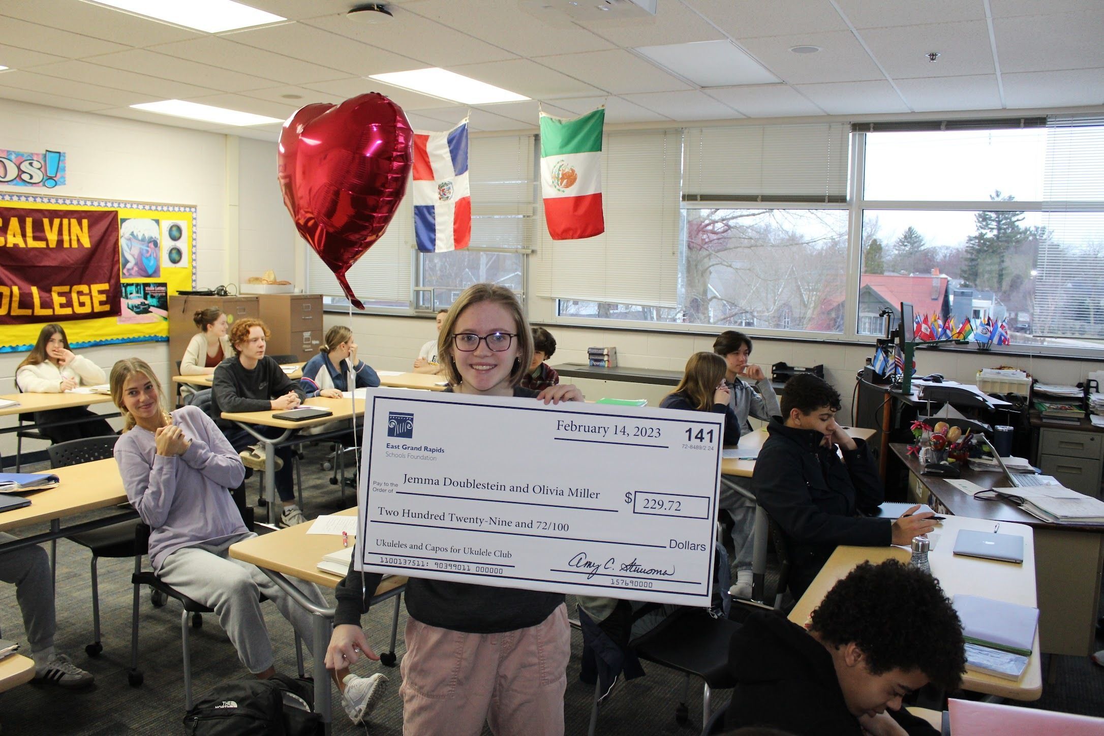 photo of student with big check