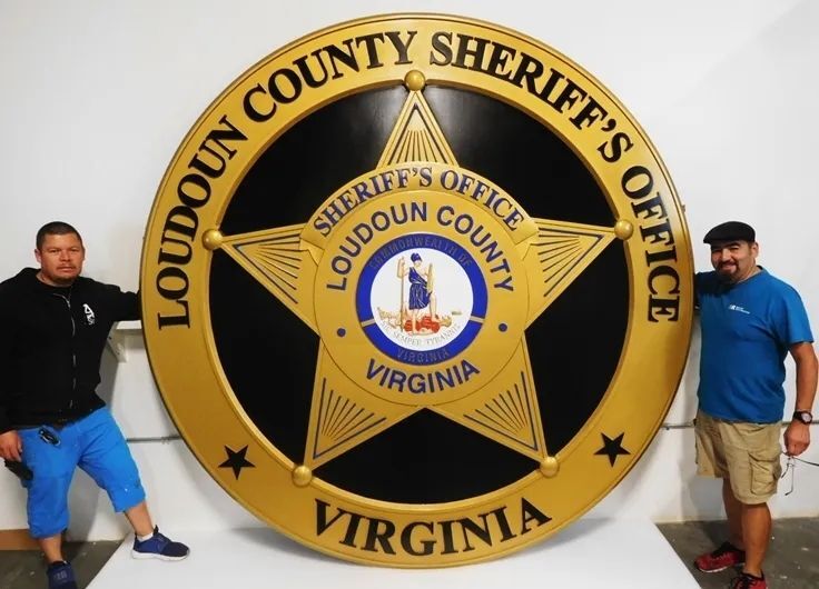 TA1014 - 10 ft diameter outdoor wall plaque of the badge for the Sheriff's Office of Loudoun County, Virginia,  carved in 2.5-D multi-level relief