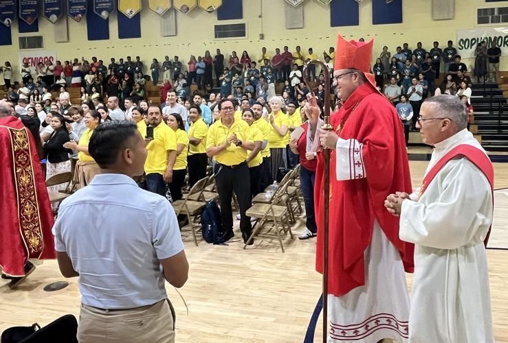 Bishop Manuel de Jesús Rodríguez processes into the Cardinal Newman gymnasium for the closing Mass of the 38th Diocesan Encuentro