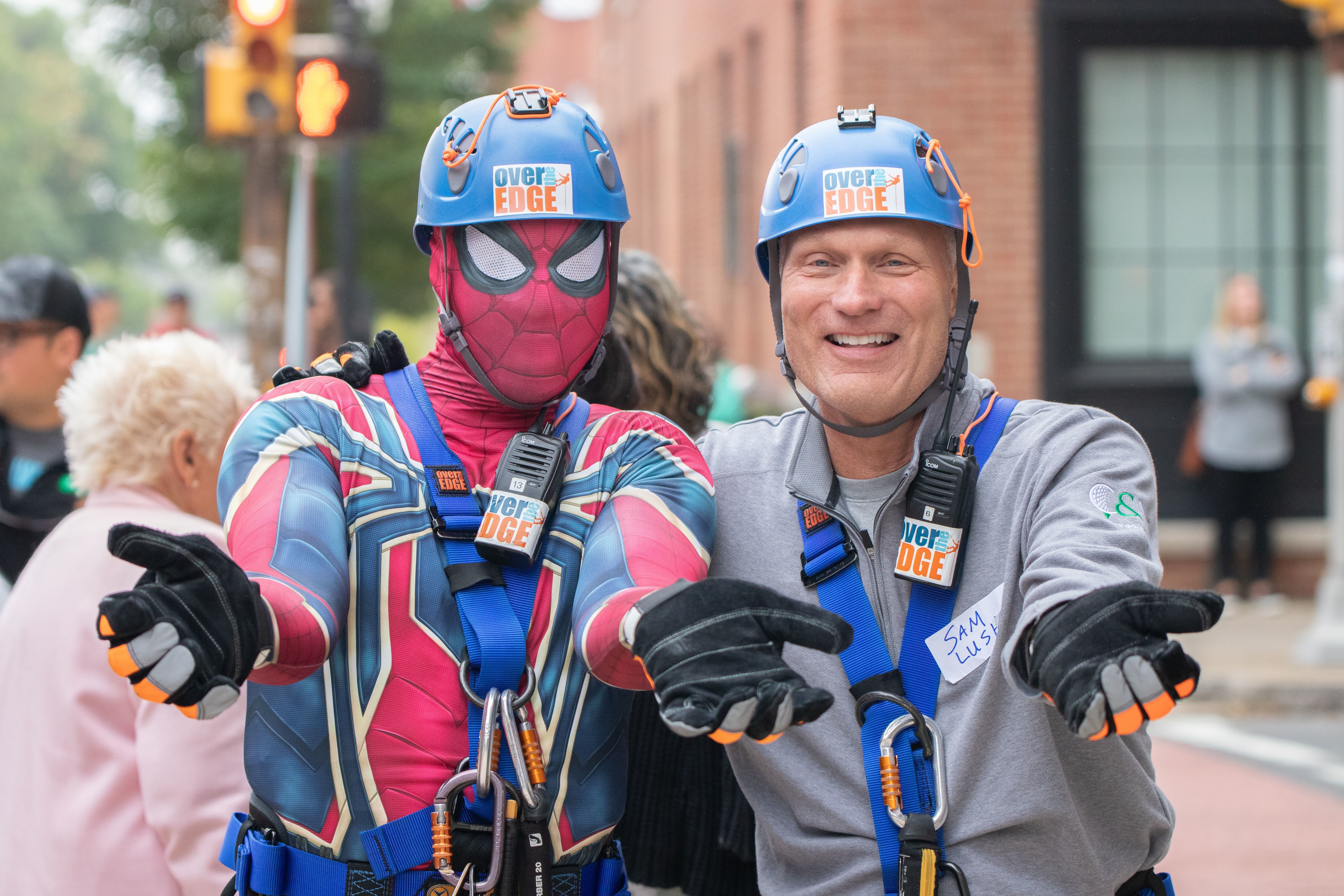 WASDEF board member Stanley Cary (left) and C&N's Sam Lush pose after rappelling from the Genetti Hotel rooftop in 2021. 