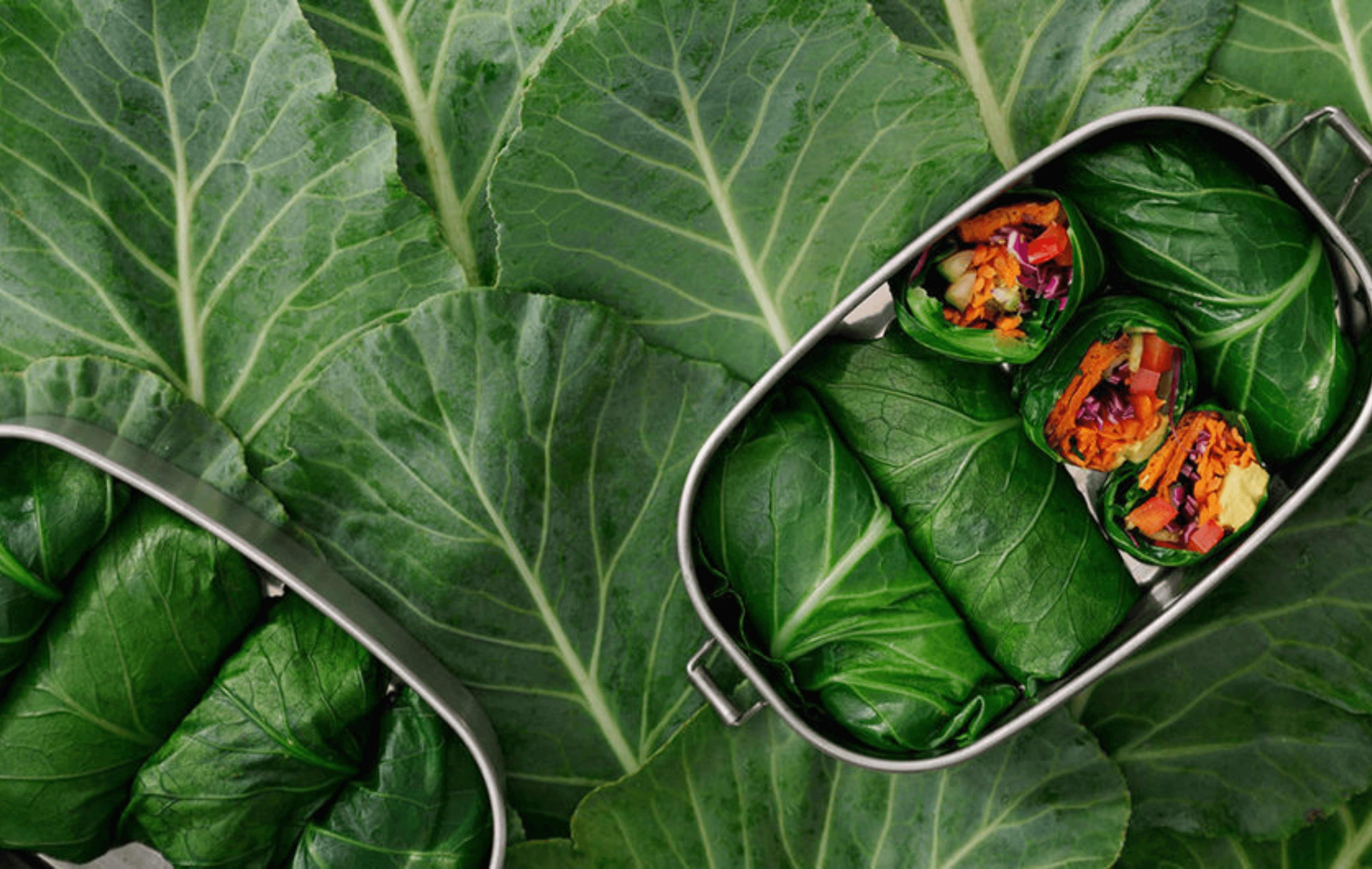 Collard green wraps filled with vegetables and hummus
