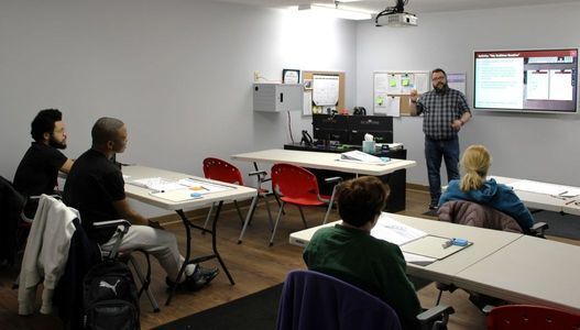 VET program interns learning in the life skills classroom