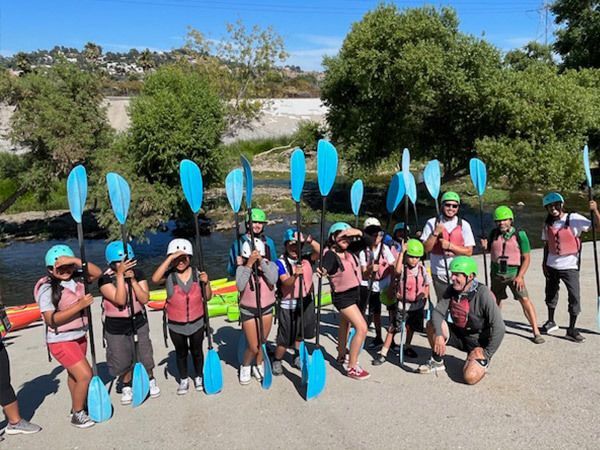 Youth ride the water during an LA River trip.