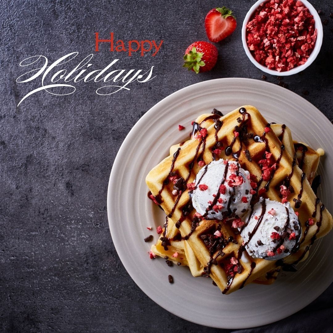 Waffles with chocolate sauce and mint leaf on top