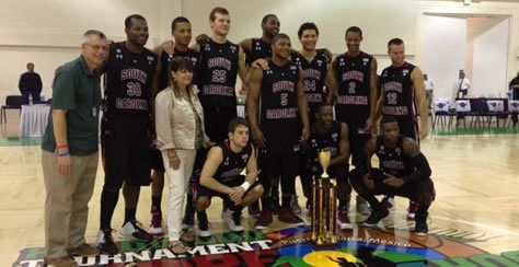 2012 NUCDF Hoops for Hope Classic Champions University of South Carolina (NUCDF's Cindy Le Mons presenting the trophy)