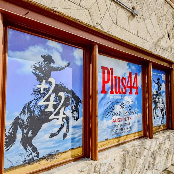 Custom window graphics that carried the branding through every inch of the space