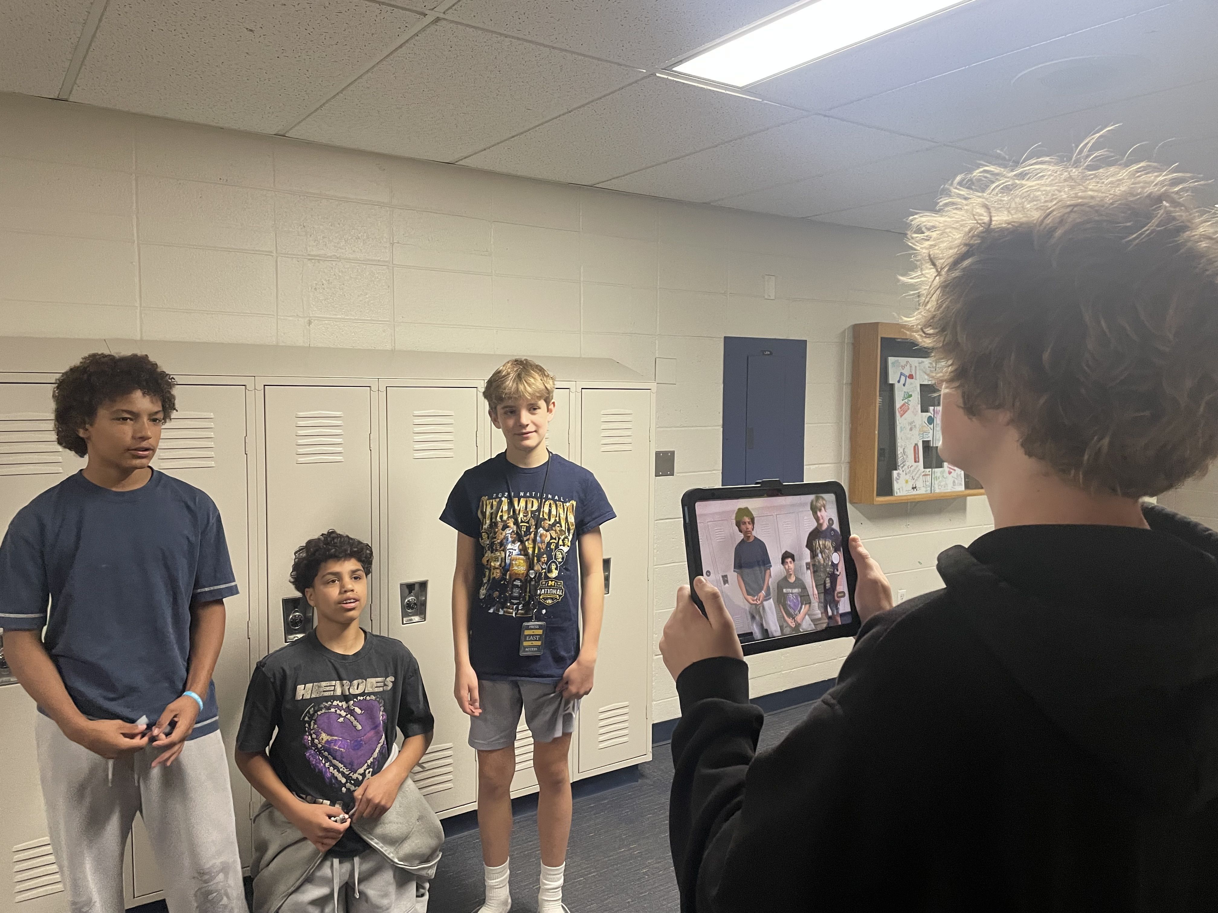 four middle school students using new iPad for video production