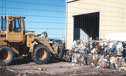 Bales Being Loaded with Front End Loader