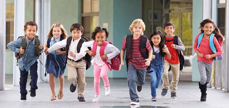 Students running outside of school