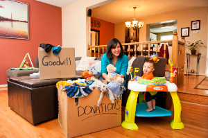 Mom and baby fill up Goodwill donation boxes