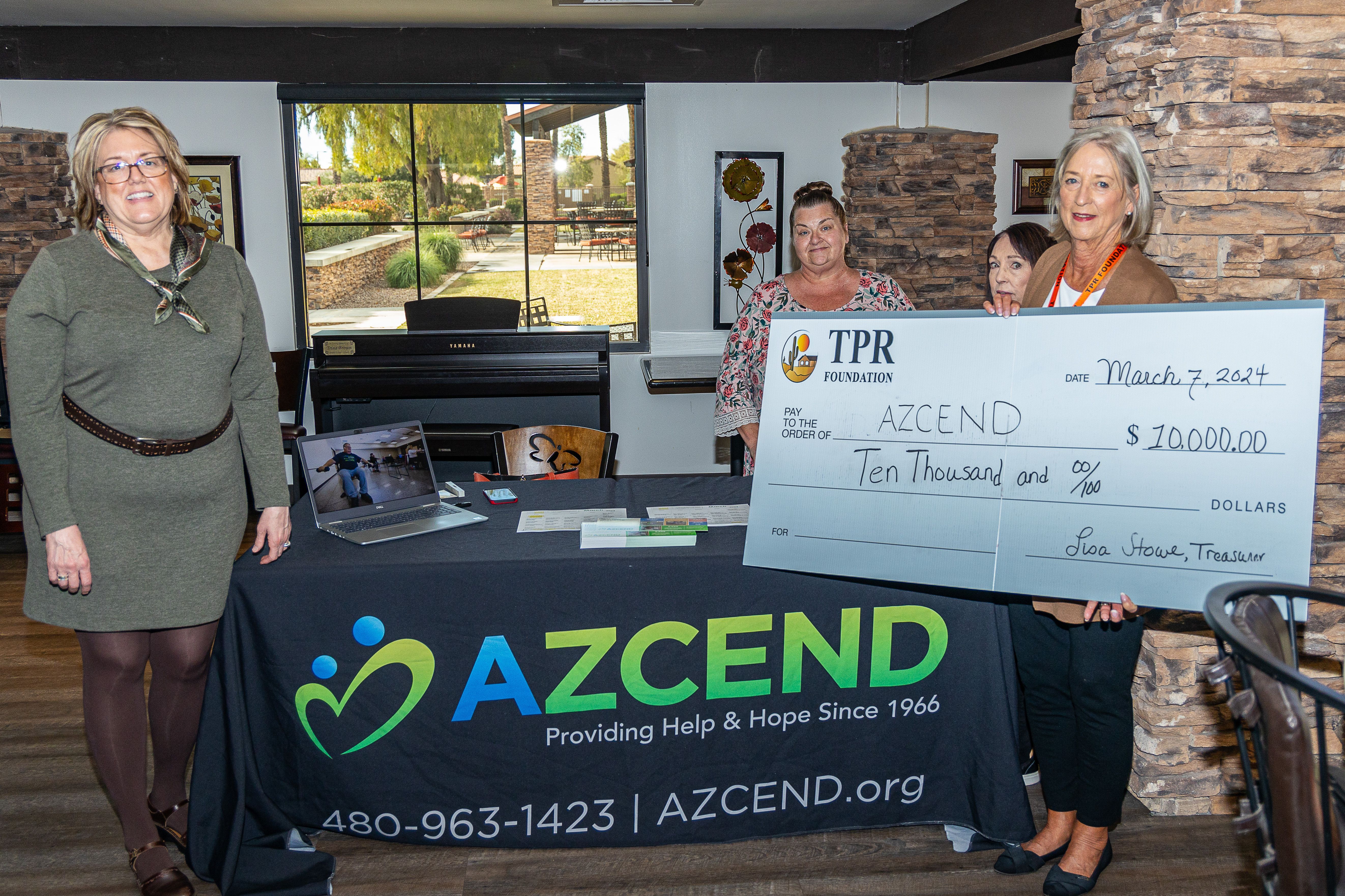 TPR Board members present $10,000 check to AZCEND. March 7, 2024