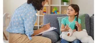 Woman holding clipboard interviewing child