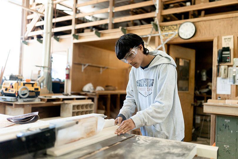 Student working in the school woodshop.
