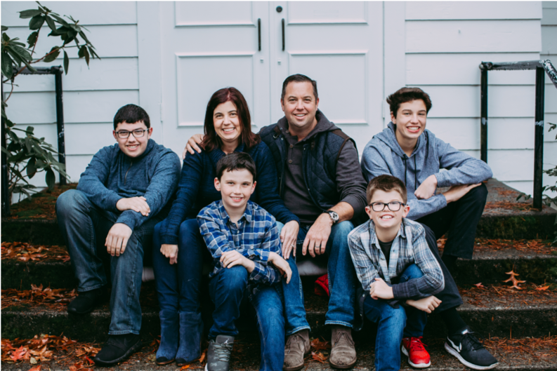 a picture of the McKittrick family sitting on a porch