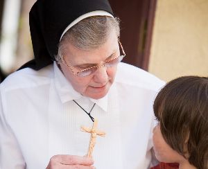 Felician Sister Theresa with child in Pomona