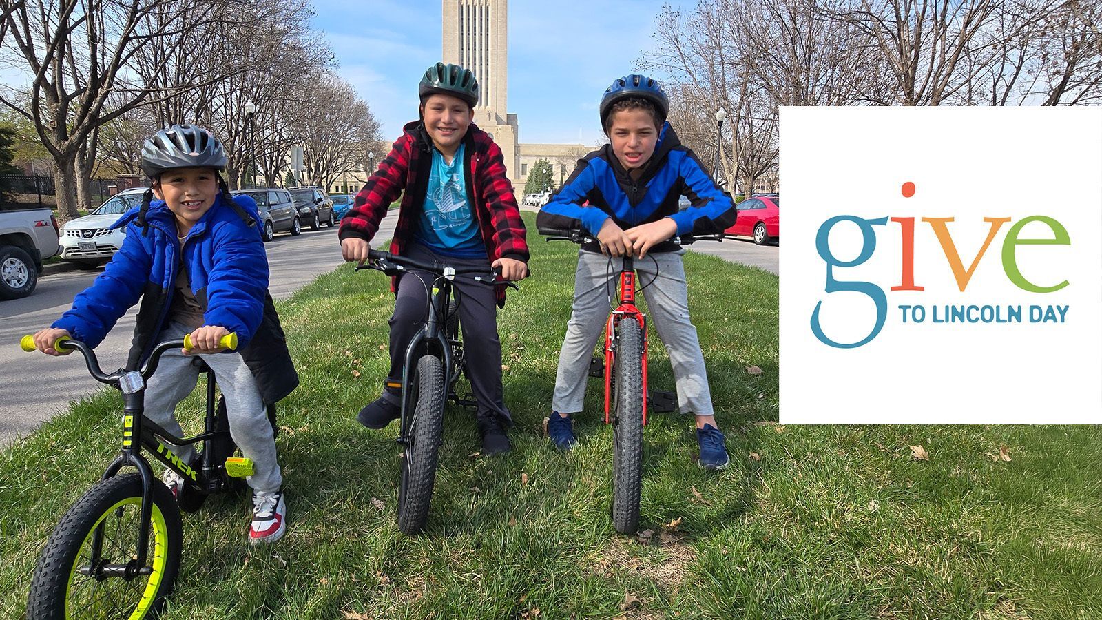 Give to Lincoln Day Row of Kids on Bikes