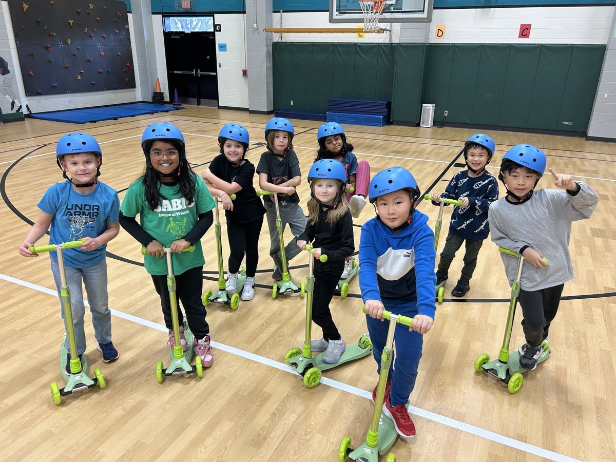 students pose with new athletic equipment purchased with grants