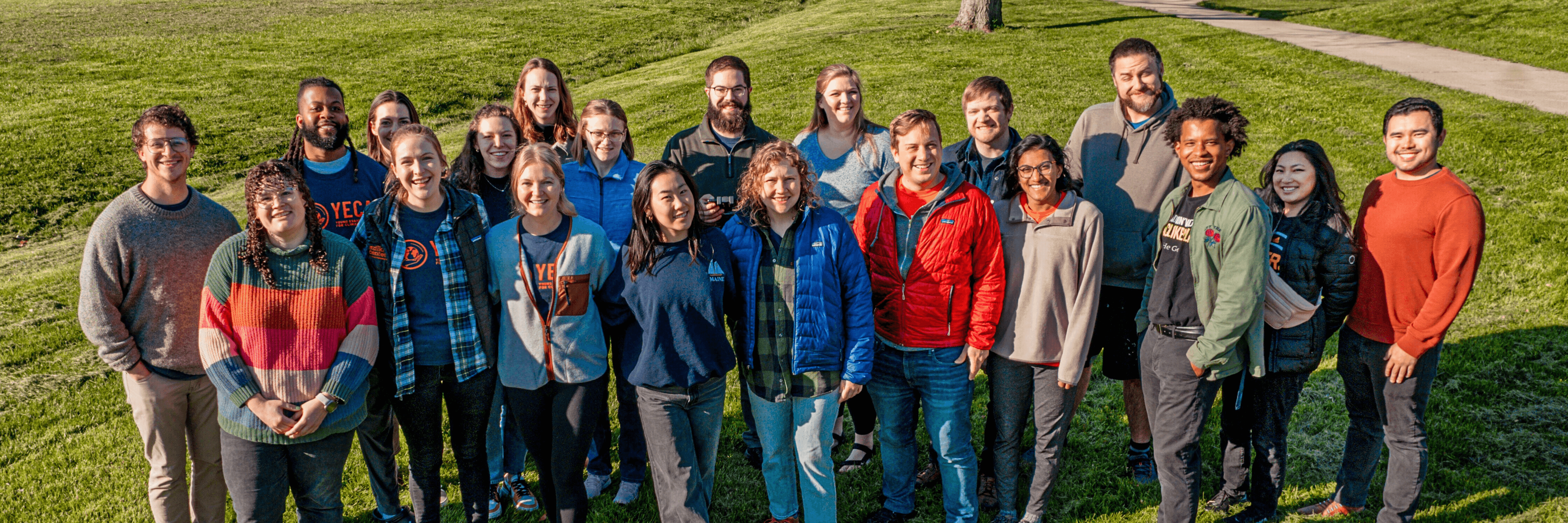 aerial group photo of YECA members in grassy field