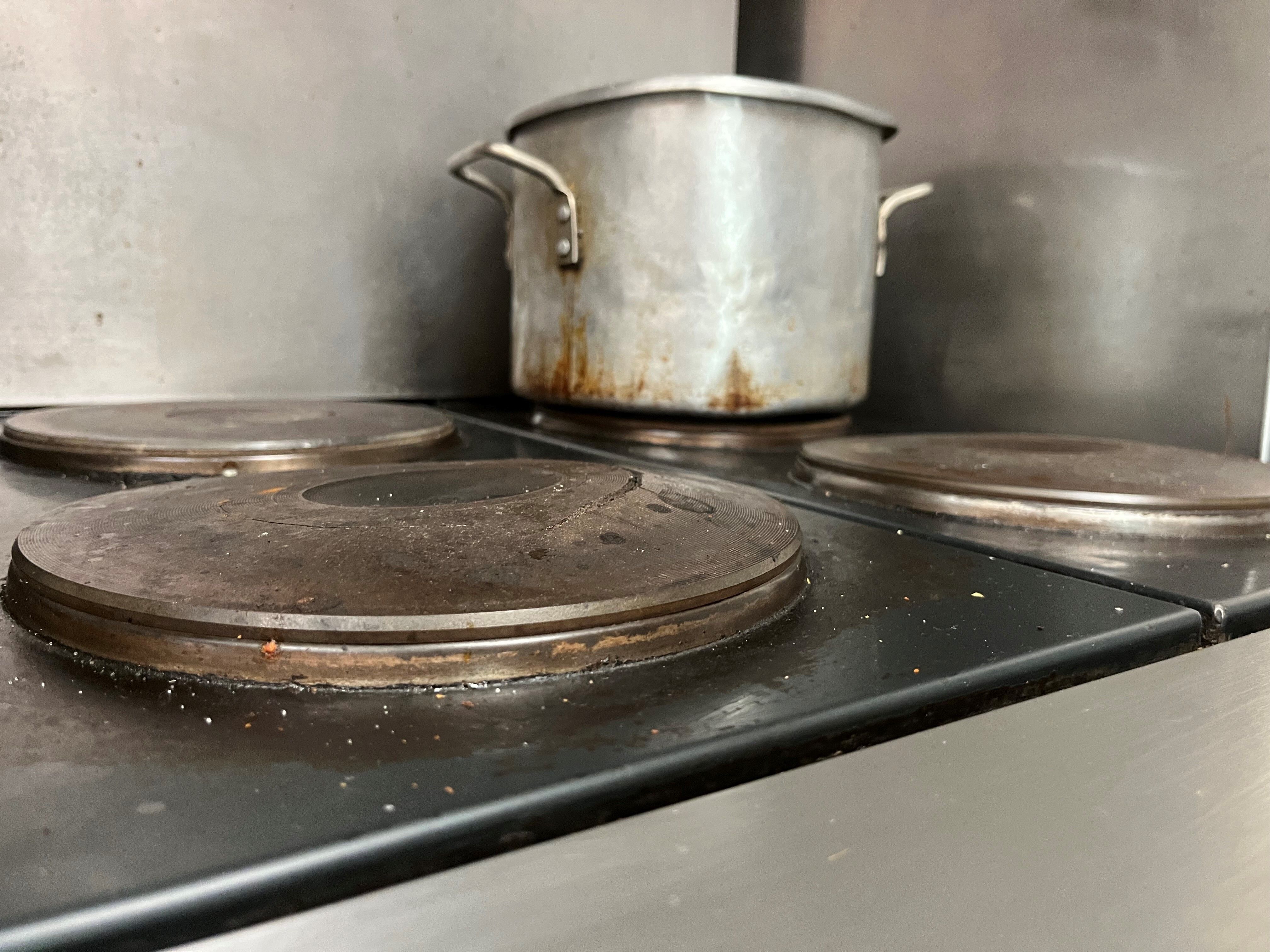 The broken stovetop in the George Street kitchen.