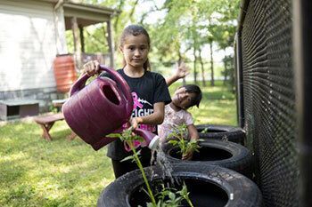 Girl watering garden