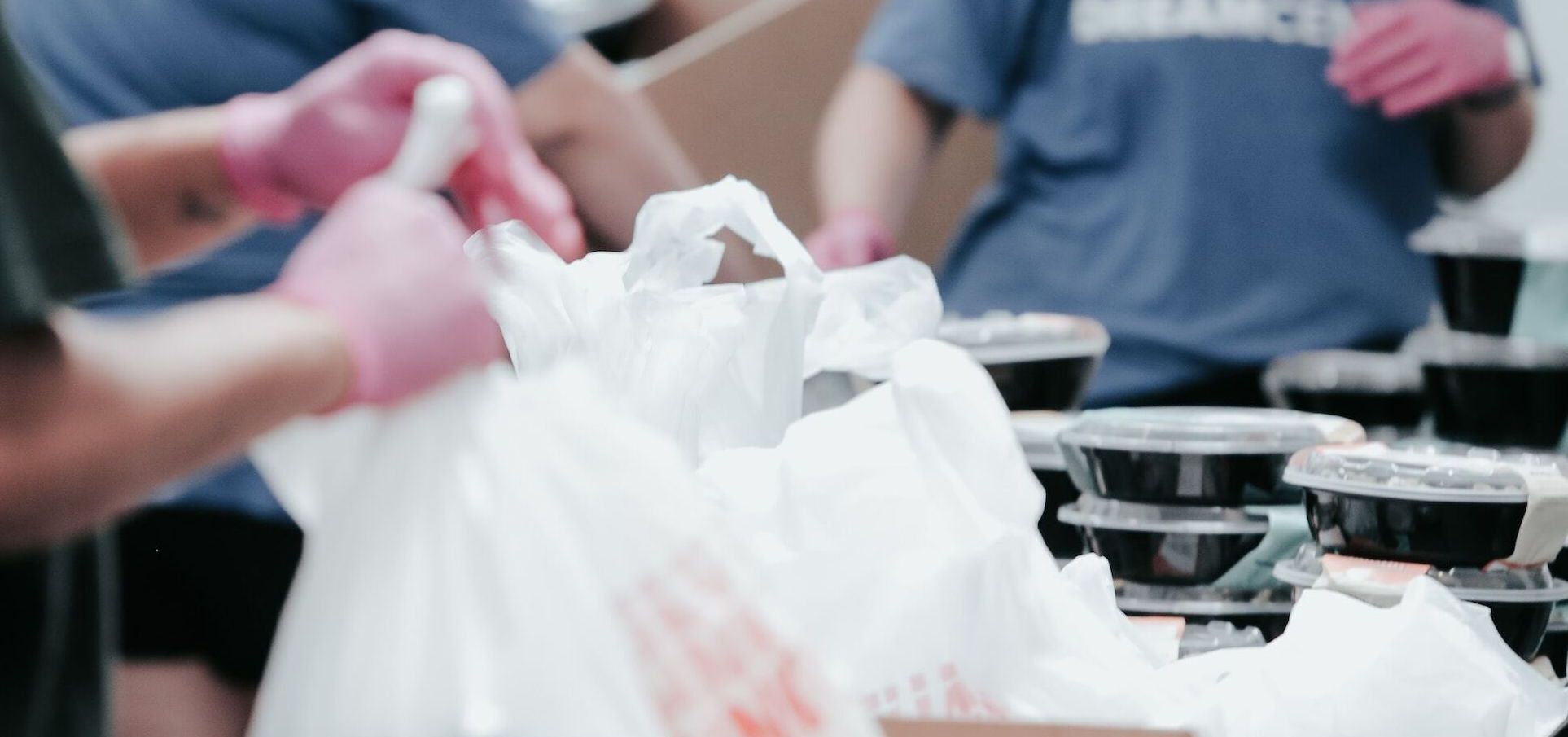 volunteers packing meals