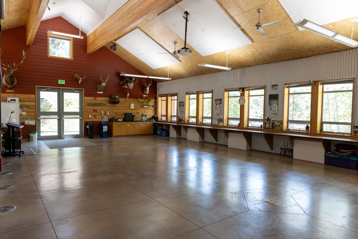 The inside of the Red Barn featuring an open space, counters, and taxidermy.