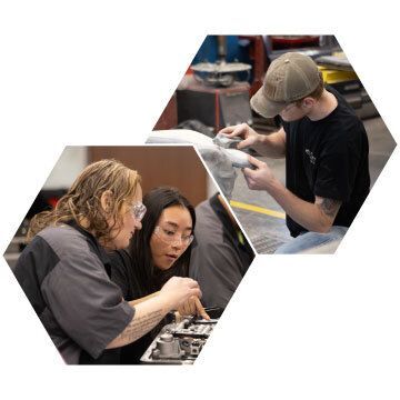 Two people looking and pointing at an engine. One person sanding auto parts.